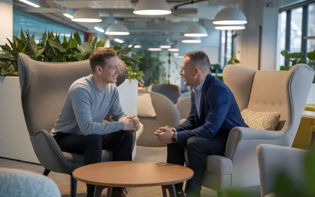 A manager engaging in an open and supportive conversation with an employee to promote mental health awareness