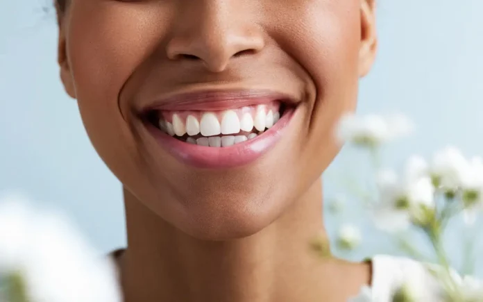 Smiling person showing healthy teeth - how to know if your teeth are healthy