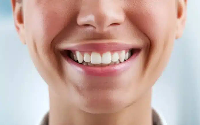 How to tell if gums are healthy with a bright, smiling person showing healthy gums