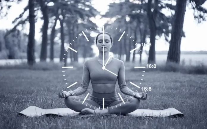 Person meditating with a clock showing fasting hours, symbolizing fasting and IBS management