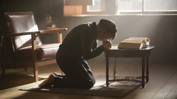 A serene image of a person praying with an open Bible, symbolizing fasting and prayer scriptures for breakthrough.