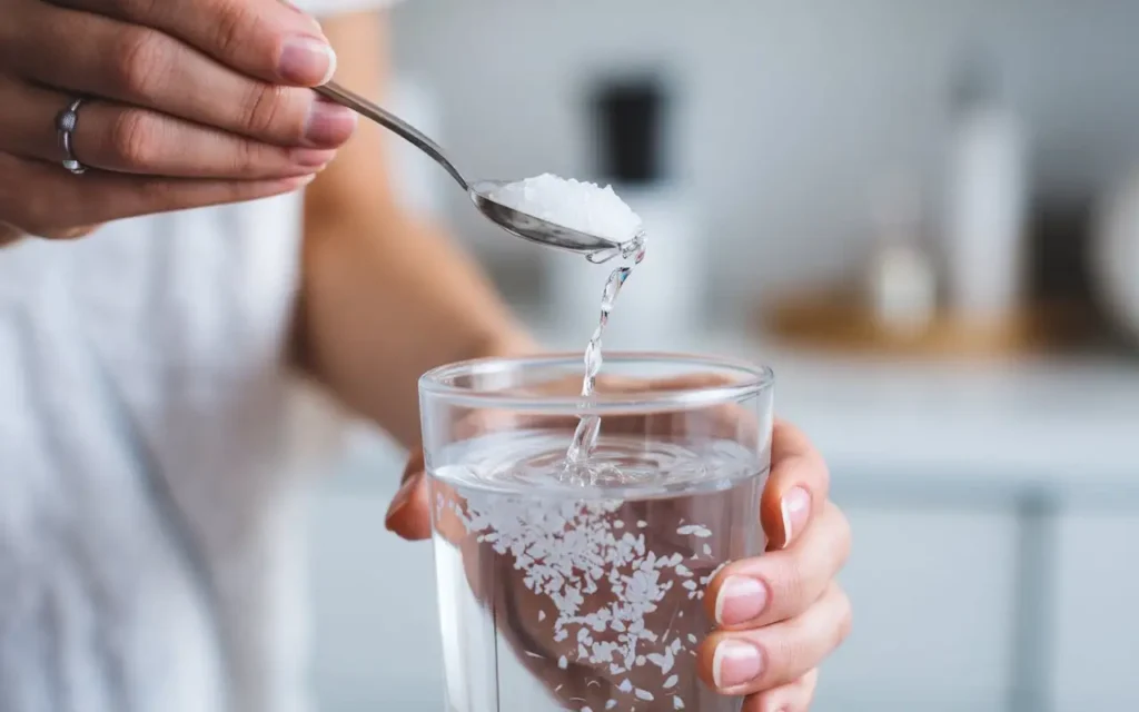 A glass of water with fasting salts being dissolved.
