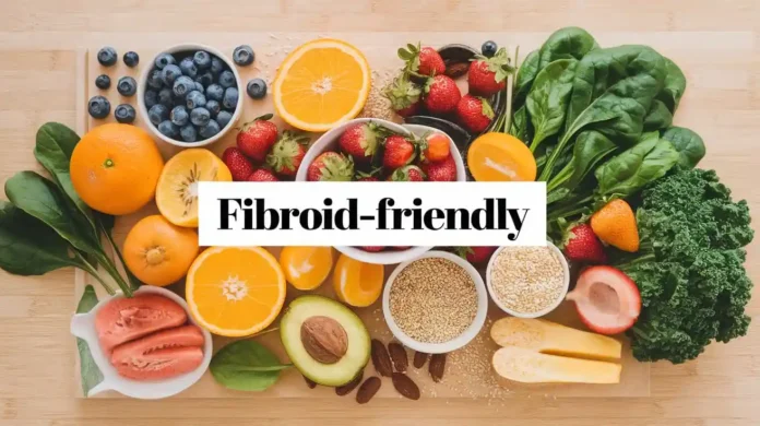 A selection of fresh, fibroid-friendly foods including leafy greens, berries, nuts, and whole grains