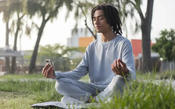 A serene person meditating with a phone turned off, representing social media fasting