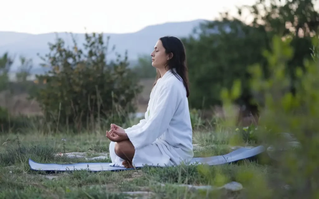 A person meditating, representing mental clarity during the fasting state.