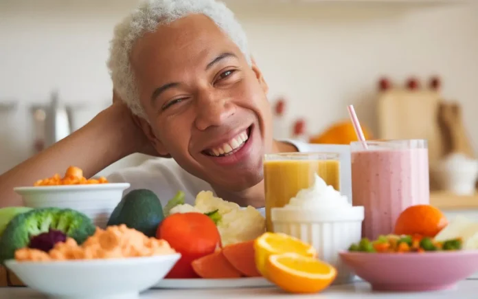 no chew diet for tmj featured image showing a table of soft foods and a smiling person