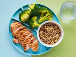 A vibrant, healthy meal plate representing the best diet for 75 Hard, with colorful vegetables, lean protein, and grains.